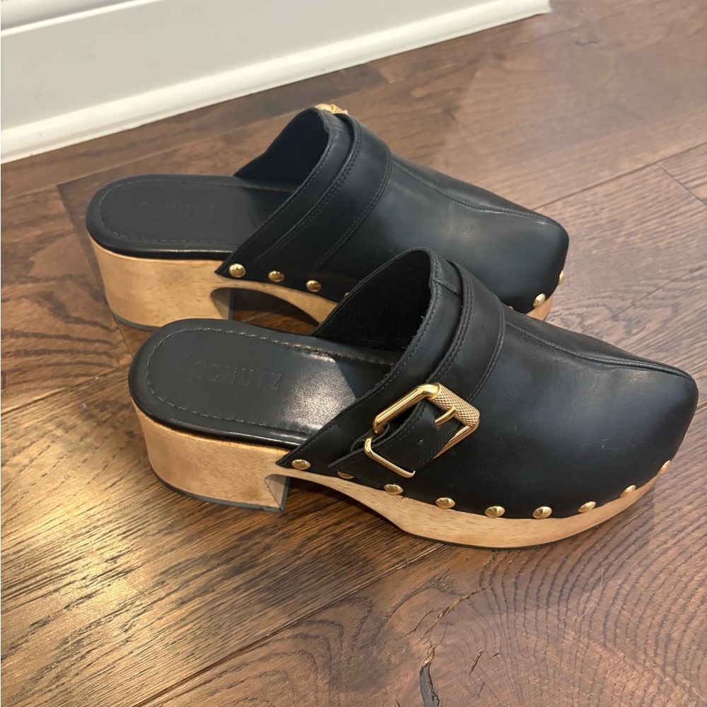 SCHUTZ Black Leather Mules with Gold Buckle